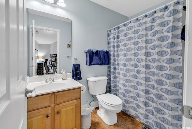 full bathroom with tile patterned floors, toilet, curtained shower, and vanity