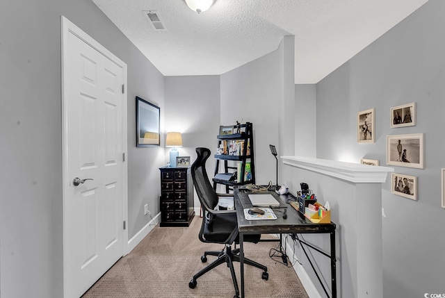 office area with baseboards, carpet, visible vents, and a textured ceiling