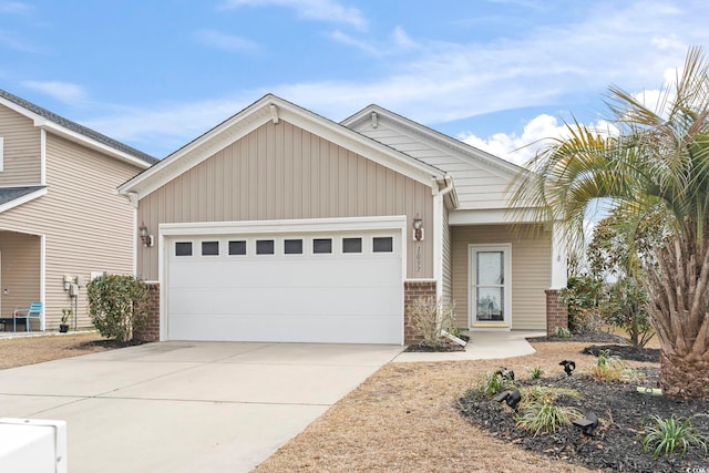 view of front of home with brick siding, concrete driveway, and an attached garage