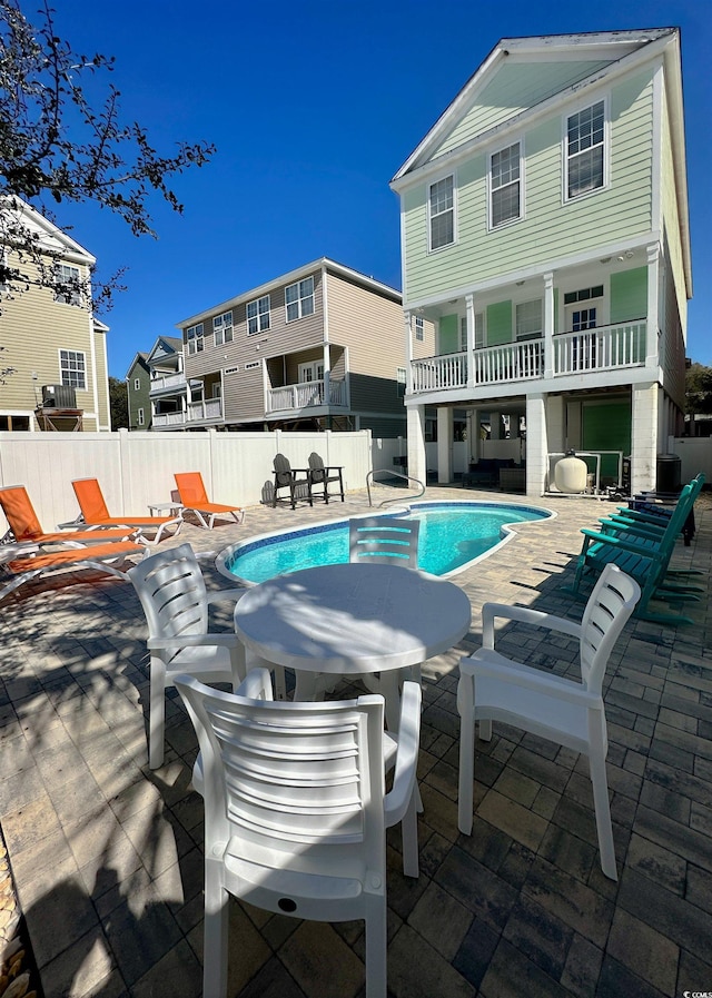 view of pool featuring a patio area, a fenced in pool, and a fenced backyard