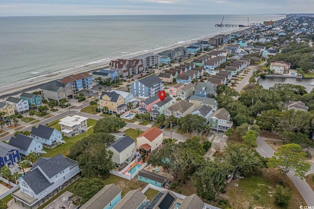 drone / aerial view featuring a residential view and a water view