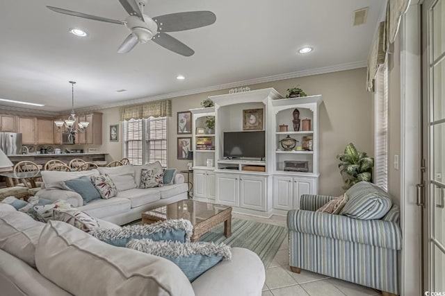 living room featuring light tile patterned floors, ornamental molding, recessed lighting, and ceiling fan with notable chandelier