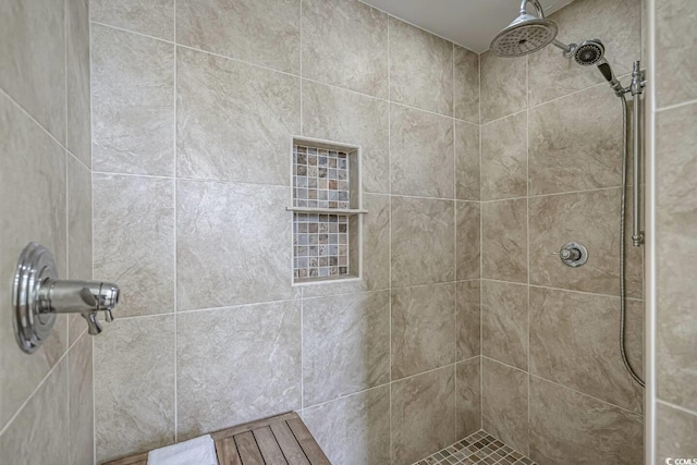 full bathroom with tiled shower