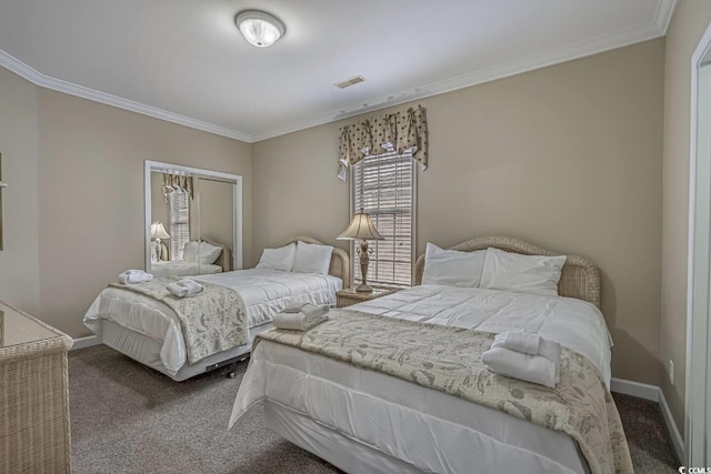 bedroom with visible vents, carpet floors, baseboards, and ornamental molding