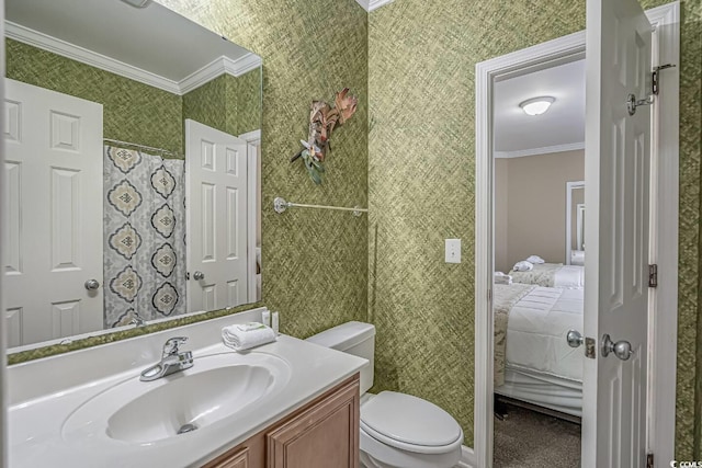 ensuite bathroom featuring toilet, ensuite bathroom, crown molding, wallpapered walls, and vanity