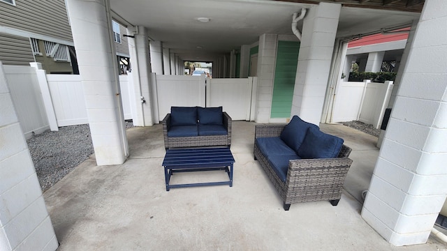 view of patio / terrace featuring outdoor lounge area and fence