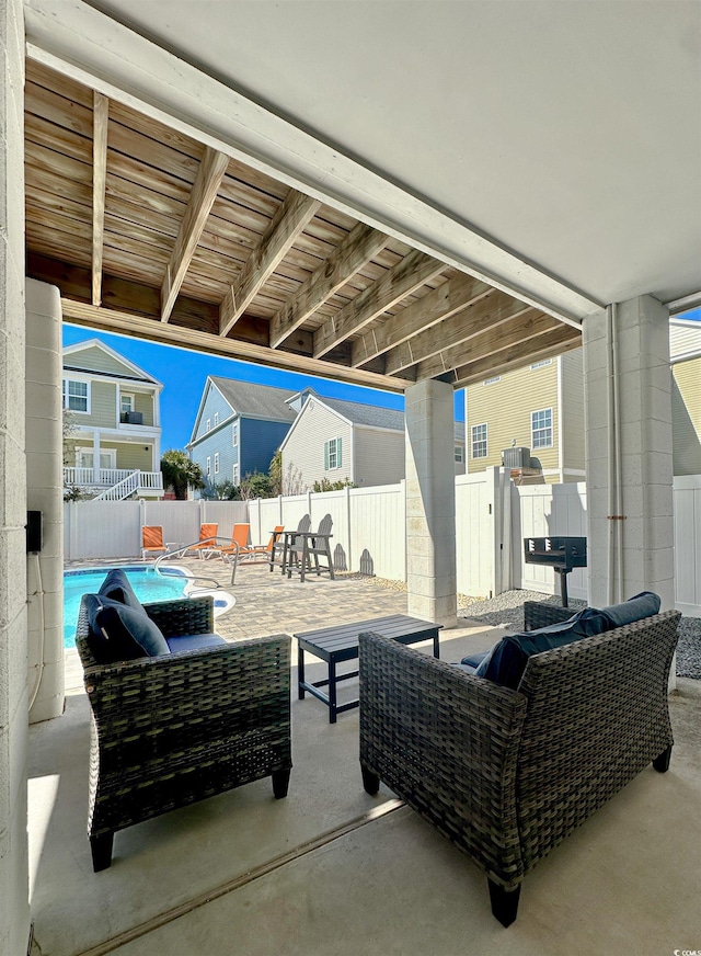 view of patio / terrace featuring a fenced in pool, outdoor lounge area, and a fenced backyard