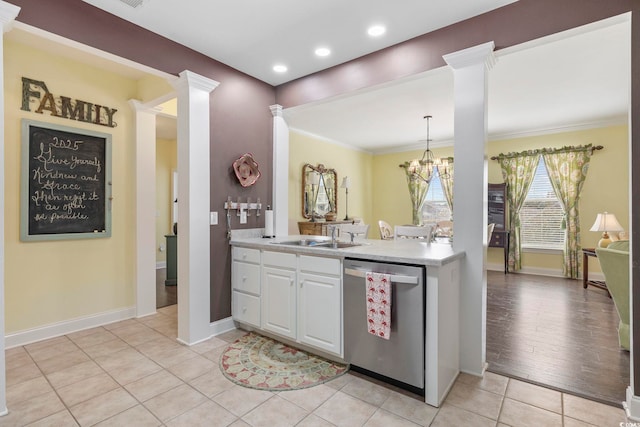 kitchen featuring ornate columns, a sink, light countertops, white cabinets, and dishwasher