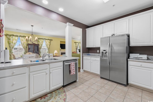 kitchen featuring white cabinets, stainless steel appliances, light countertops, and a sink