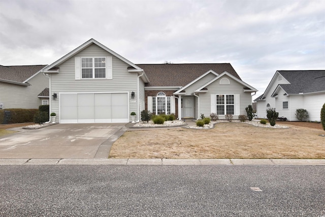 traditional-style home with concrete driveway and an attached garage