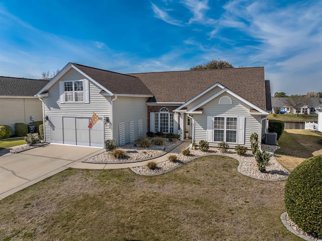 view of front facade featuring central AC unit, driveway, a front yard, and a garage