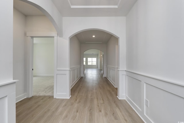 4028 Bucolic Loop, Myrtle Beach, SC 29588 - hall featuring light wood-style flooring, arched walkways, a decorative wall, wainscoting, and recessed lighting