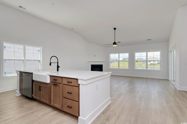 4028 Bucolic Loop, Myrtle Beach, SC 29588 - kitchen with a sink, ceiling fan, stainless steel dishwasher, light wood-type flooring, and vaulted ceiling