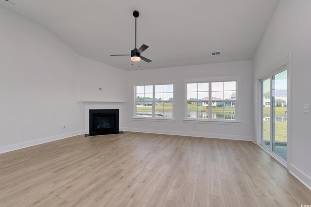 4028 Bucolic Loop, Myrtle Beach, SC 29588 - unfurnished living room with lofted ceiling, light wood-style floors, ceiling fan, and healthy amount of natural light