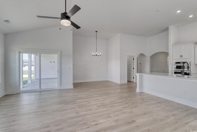 4028 Bucolic Loop, Myrtle Beach, SC 29588 - unfurnished living room with a ceiling fan, light wood finished floors, arched walkways, high vaulted ceiling, and recessed lighting