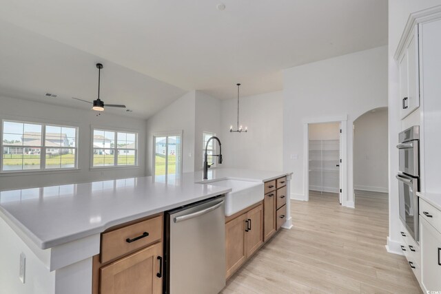 4028 Bucolic Loop, Myrtle Beach, SC 29588 - kitchen featuring appliances with stainless steel finishes, a sink, light wood-style floors, lofted ceiling, and a ceiling fan
