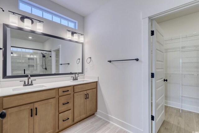 4028 Bucolic Loop, Myrtle Beach, SC 29588 - full bath with a walk in closet, a tile shower, double vanity, baseboards, and wood finished floors