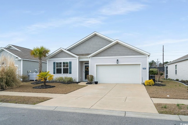 ranch-style home featuring a garage and concrete driveway