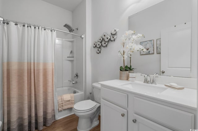 full bathroom with toilet, vanity, wood finished floors, and shower / bath combination with curtain