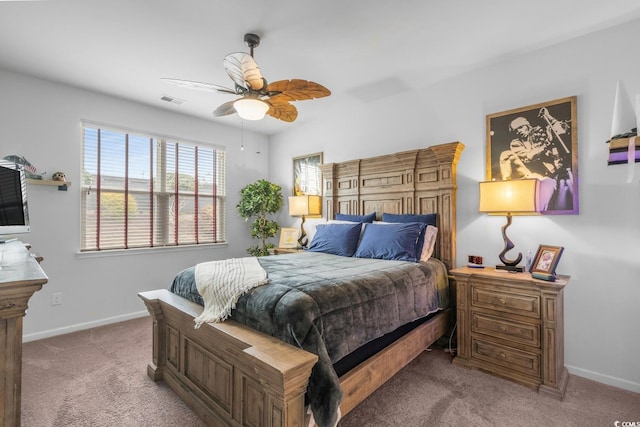 bedroom featuring carpet flooring, baseboards, visible vents, and a ceiling fan