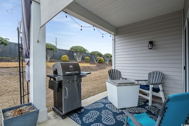 view of patio with a fenced backyard and a grill