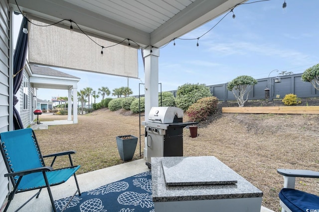 view of patio featuring a grill