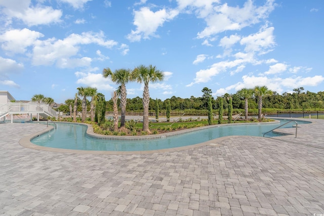community pool featuring a patio area