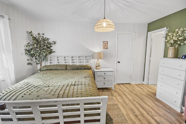 bedroom with wood finished floors