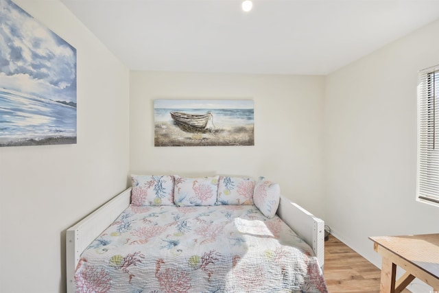 bedroom featuring wood finished floors