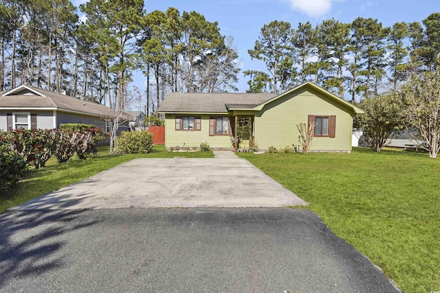 ranch-style home featuring a front yard