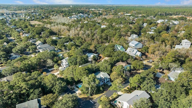 birds eye view of property featuring a residential view and a view of trees