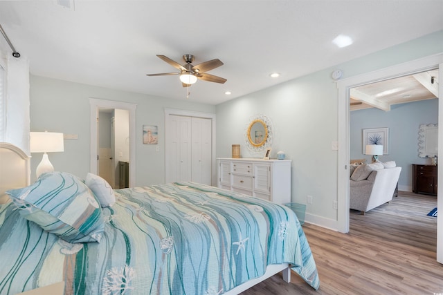 bedroom with ceiling fan, baseboards, recessed lighting, wood finished floors, and a closet