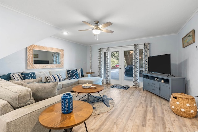 living room with ceiling fan, french doors, light wood finished floors, and ornamental molding