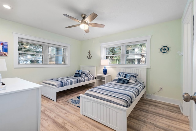 bedroom with recessed lighting, baseboards, light wood-style floors, and a ceiling fan