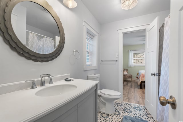 bathroom featuring toilet and vanity