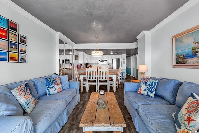 living room featuring a textured ceiling, dark wood finished floors, and crown molding