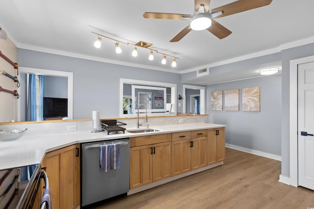 kitchen with visible vents, light countertops, ornamental molding, stainless steel dishwasher, and a sink