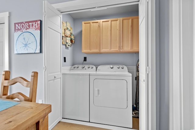 laundry area featuring cabinet space and washing machine and clothes dryer