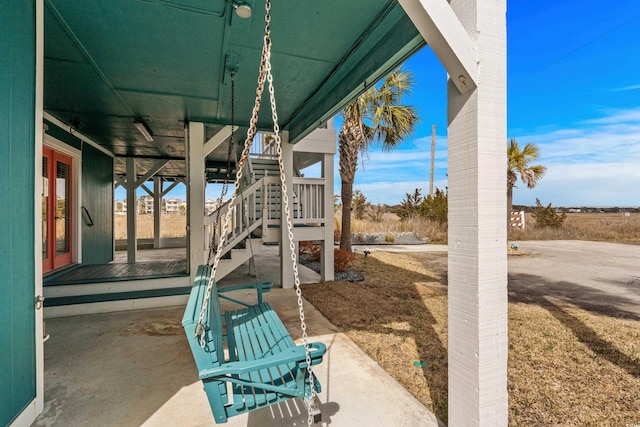 view of patio with french doors and stairs