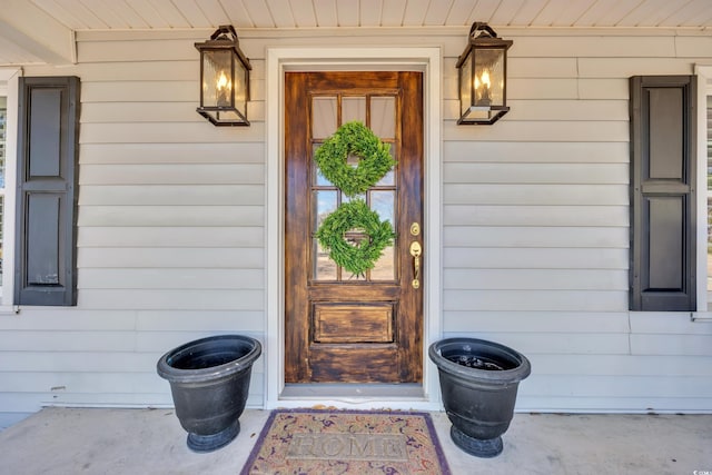 view of exterior entry featuring a porch