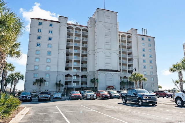 view of property featuring uncovered parking