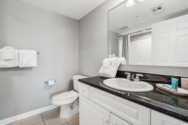 full bath featuring tile patterned flooring, visible vents, toilet, vanity, and a textured ceiling