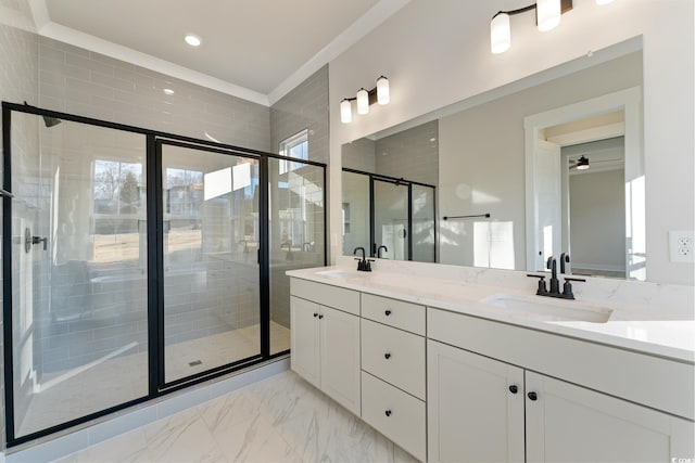 bathroom featuring double vanity, a stall shower, marble finish floor, and a sink