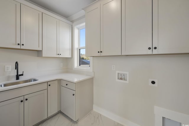 laundry room with cabinet space, a sink, washer hookup, electric dryer hookup, and marble finish floor