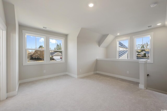 additional living space featuring recessed lighting, visible vents, and baseboards