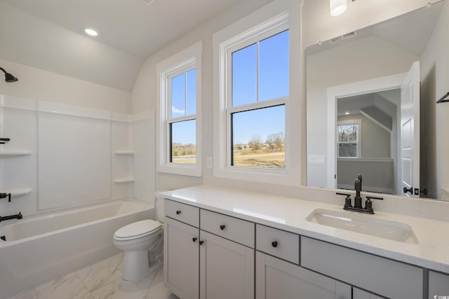 full bathroom featuring vanity, lofted ceiling, toilet, and plenty of natural light