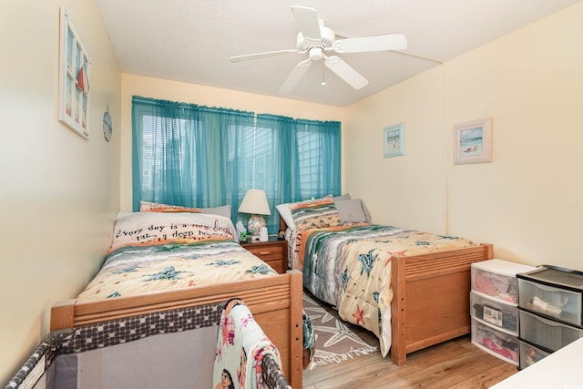 bedroom featuring wood finished floors and ceiling fan