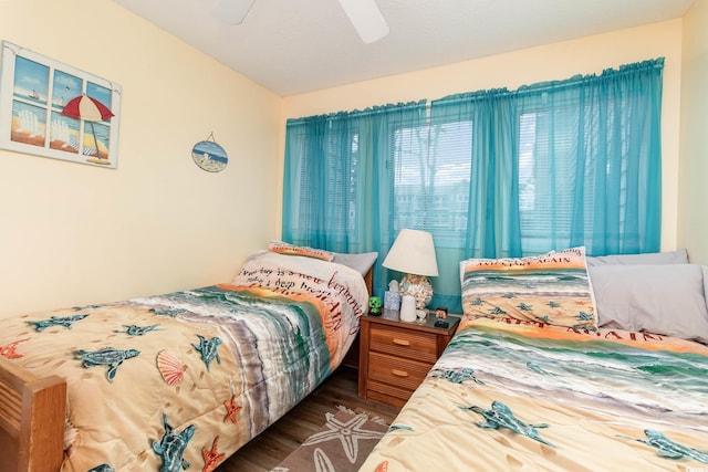 bedroom with wood finished floors and ceiling fan