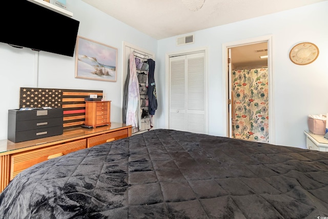 bedroom with a closet and ensuite bathroom