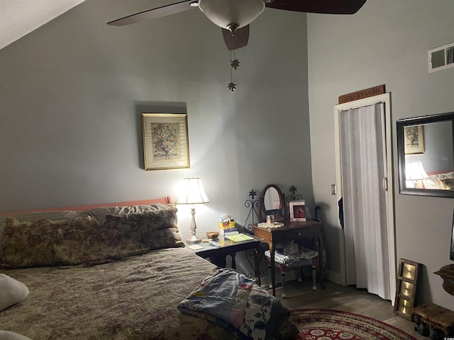 bedroom with visible vents, a ceiling fan, and wood finished floors